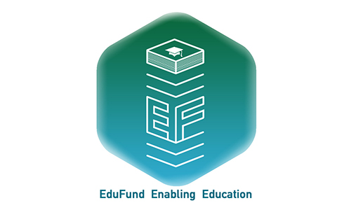 The logo for EduFund, a blue-green hexagon with a white outline of a stack with the capital letters "E" and "F" topped by a graduation cap. The words "EduFund Enabling Education" sit underneath the hexagon.