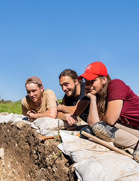 Anthropology students studying at a dig site.