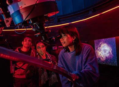 A telescope looking at the sky in the observatory.