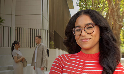 Students standing in front of the Michael Kirby Building on Wally's Walk.