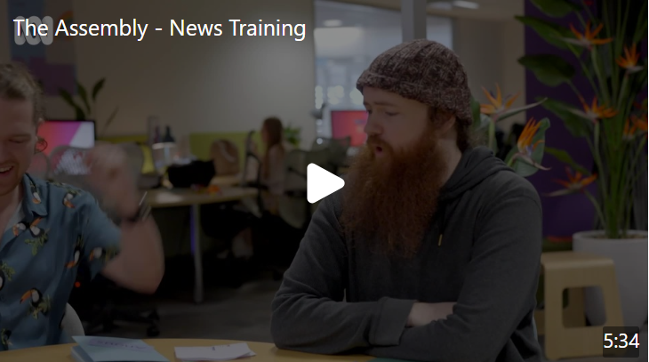 Thumbnail of video featuring man with beanie and beard in a classroom