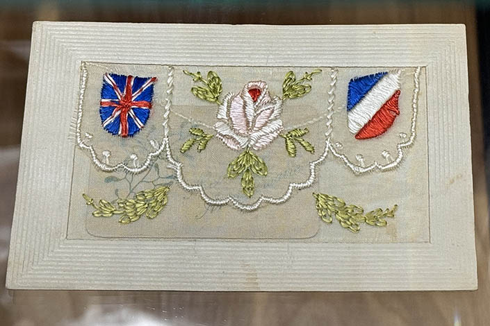 Embroided postcard featuring British and French Flags