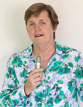 Michele Nealon holding a microphone