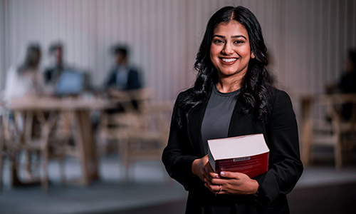 Female student holding books