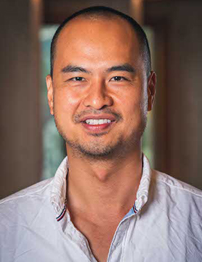 David Dinh, a smiling man in a pale shirt.