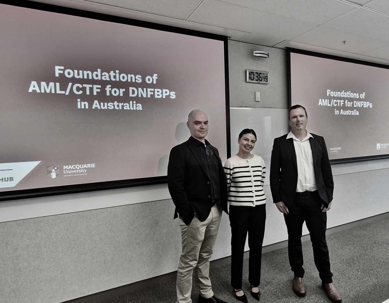 Three people standing in front of a screen which reads: Foundations of AML/CTF for DNFBPs in Australia