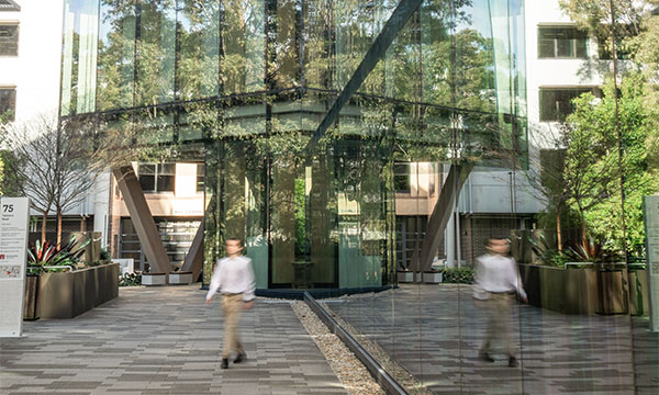 A person walking on the Macquarie University campus.