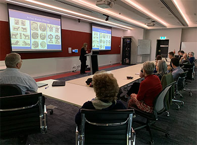 Several academics attending a research presentation at Macquarie University campus