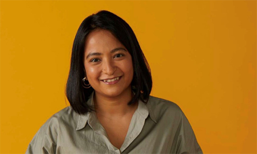 Gunjan portrait photo with an orange background