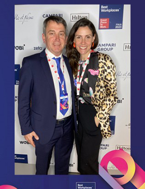 Zoe Flaherty posing for a photo at an awards ceremony with a man by her side